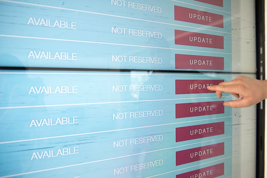 A close-up photograph of a computer screen displaying colorful lines of code, including syntax-highlighted JavaScript or similar programming language, with elements such as functions, variables, and c